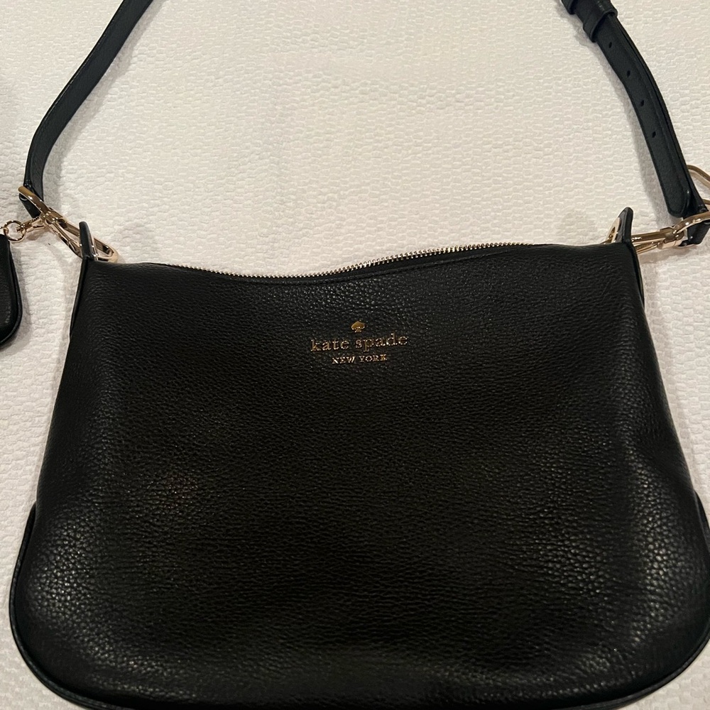 Kate Spade, brand new, only used once for a brief period of time.